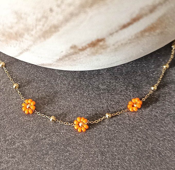 Bracelet-acier-chaine-maillon-fleur-orange-dore